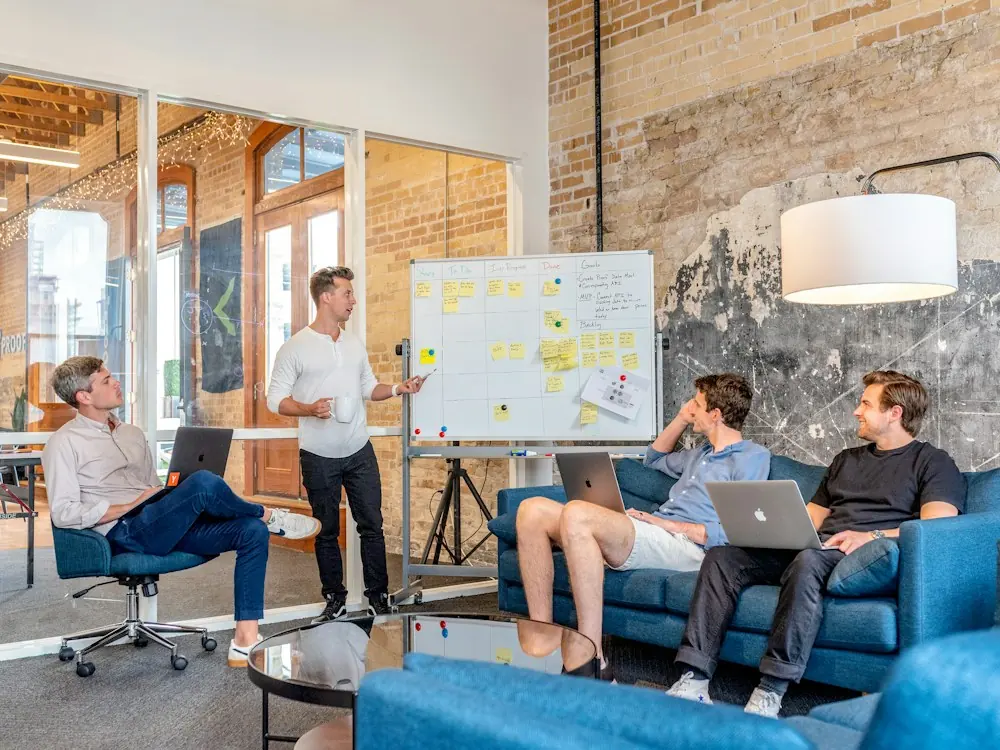 An agency team reviewing ideas on a whiteboard