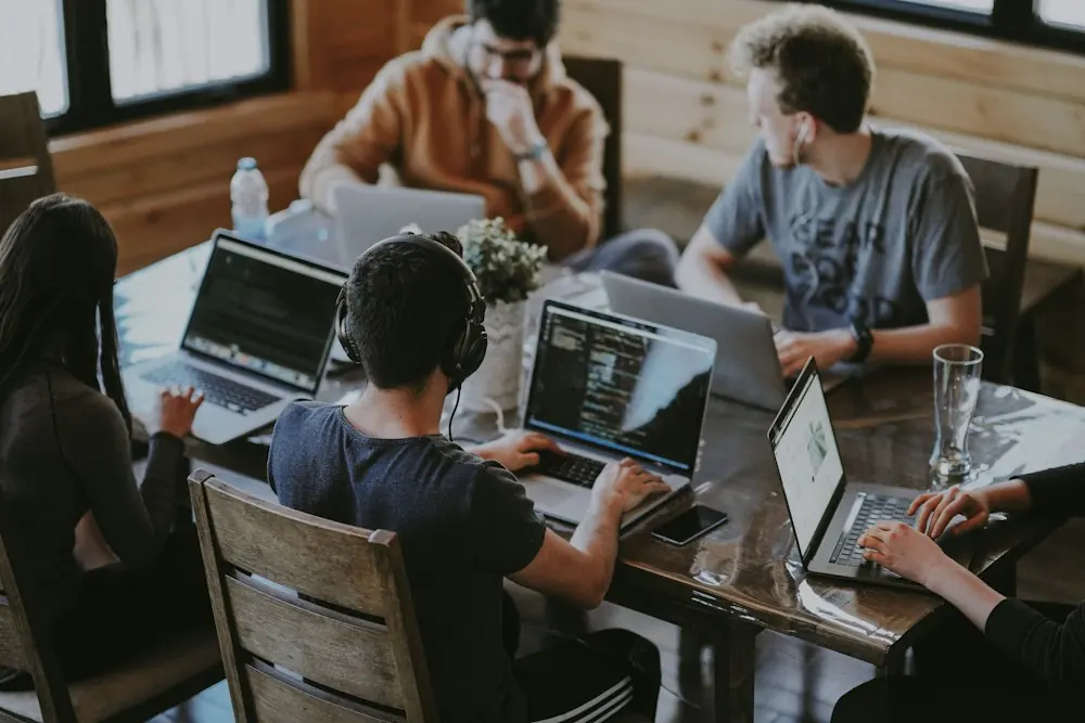 Publishers and affiliate marketers working on laptops