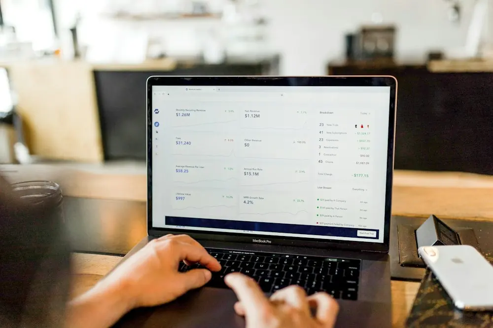 Hands typing a message on a laptop