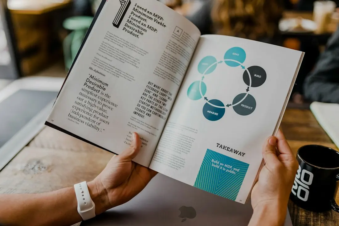 A person reading a strategy document with a diagram
